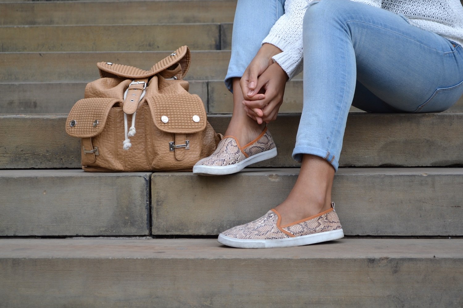 River Island Brown Faux Leather Backpack and H&M snakeskin print plimsolls